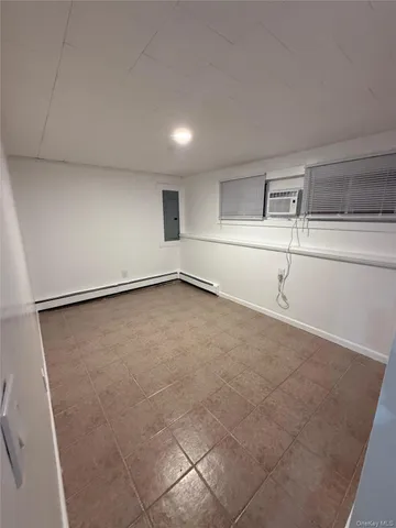 a view of a kitchen with a sink and a refrigerator