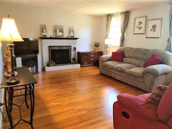 8 Fencourt Road Canton, MA 02021 - Photo 2 of 33 a living room with furniture and a fireplace