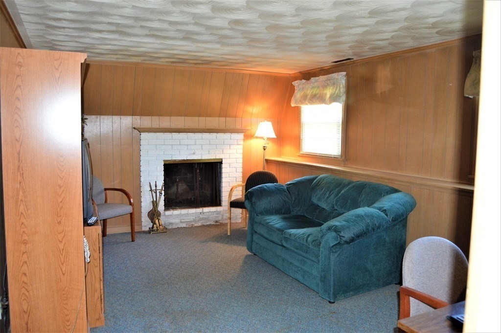 8 Fencourt Road Canton, MA 02021 - Photo 23 of 33 a living room with furniture and a fireplace
