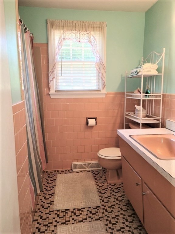 8 Fencourt Road Canton, MA 02021 - Photo 10 of 33 a bathroom with a toilet a sink and a window