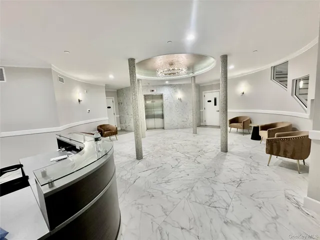 a living room with furniture and a dining table