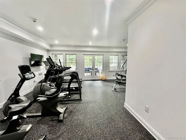 a room with gym equipment and a window