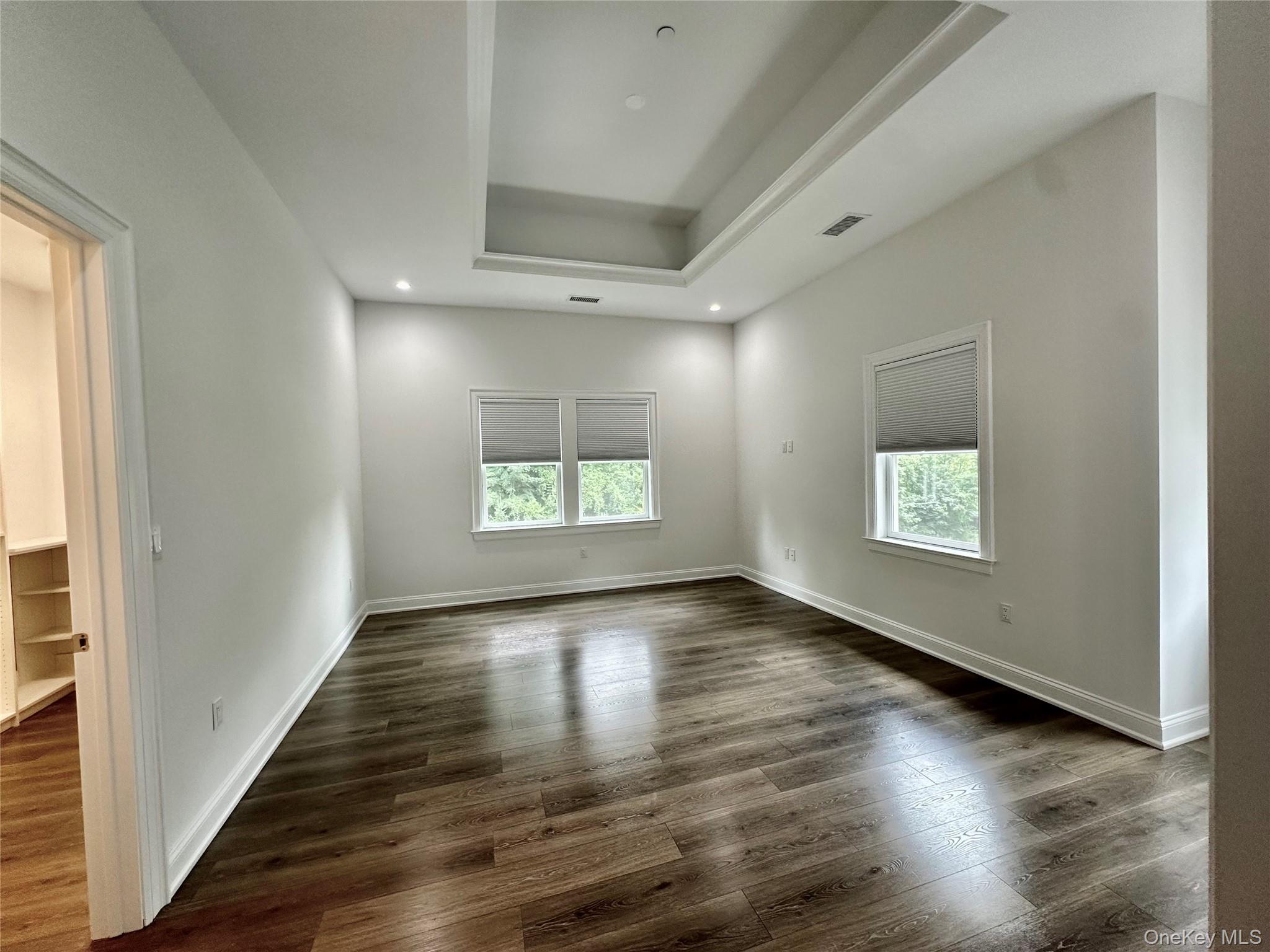 585 Main Street Armonk, NY 10504 - Photo 8 of 19 an empty room with wooden floor and windows