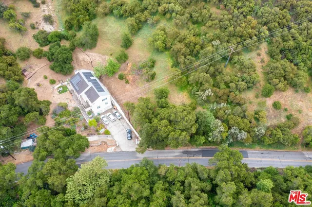 an aerial view of residential house with outdoor space