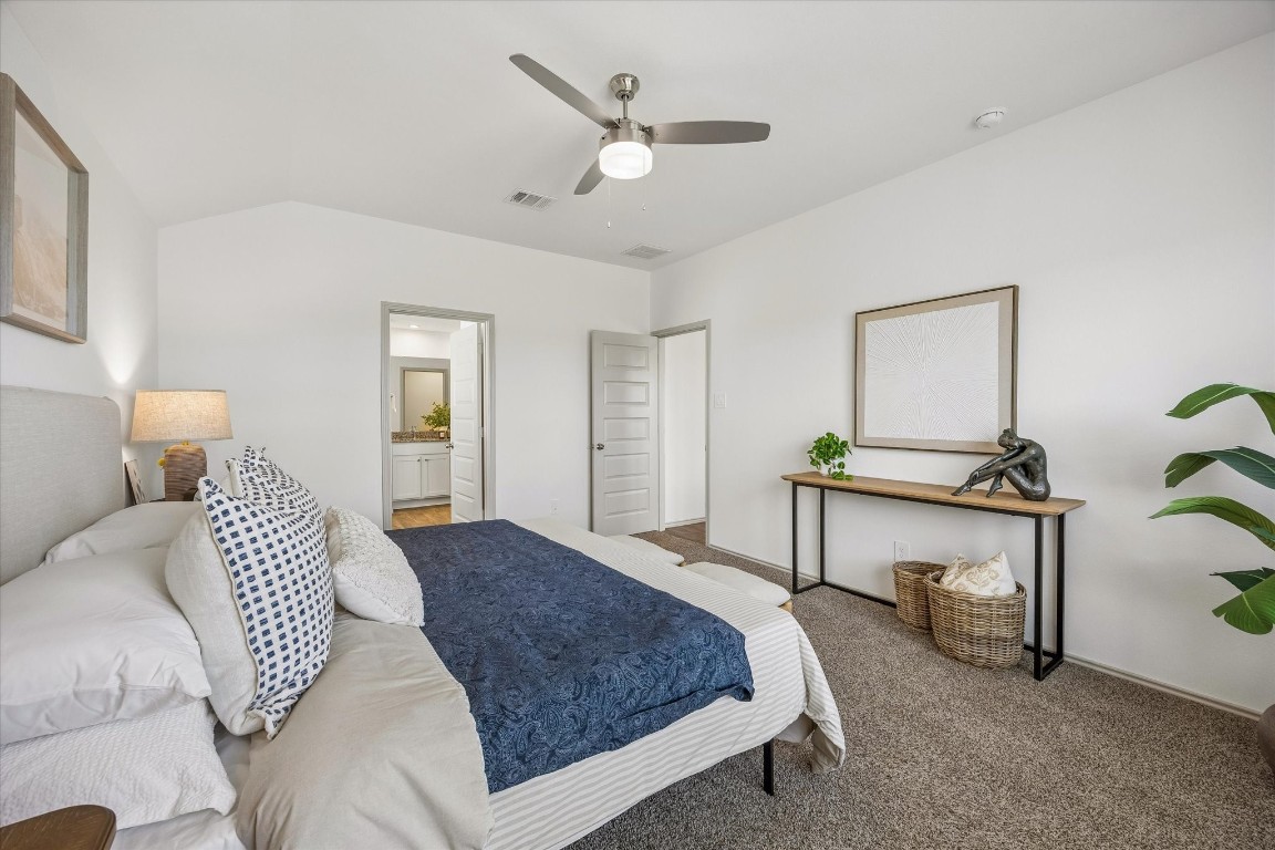 3505 Rockefeller Road Texas City, TX 77591 - Photo 11 of 23 View of the primary suite with an adjoining en-suite bathroom and the entry door.
