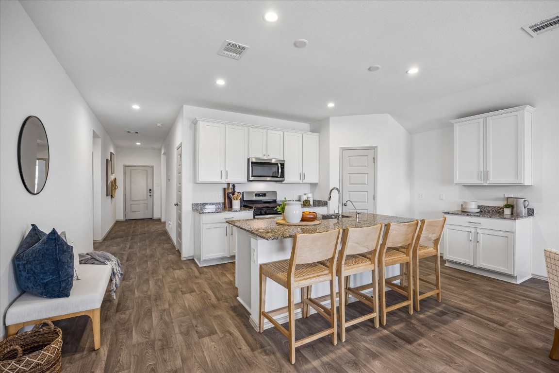 3505 Rockefeller Road Texas City, TX 77591 - Photo 6 of 23 Front/Main walkway leads to the bright and inviting kitchen that is open to the dining and living area.