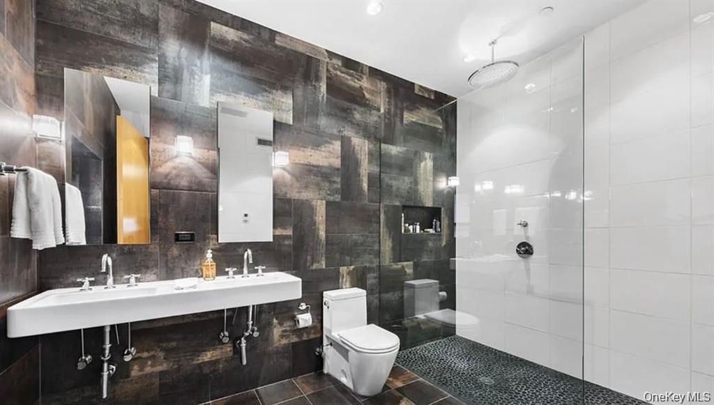 500 Greenwich Street, Unit 401 Manhattan, NY 10013 - Photo 15 of 22 a bathroom with a double vanity sink mirror and toilet