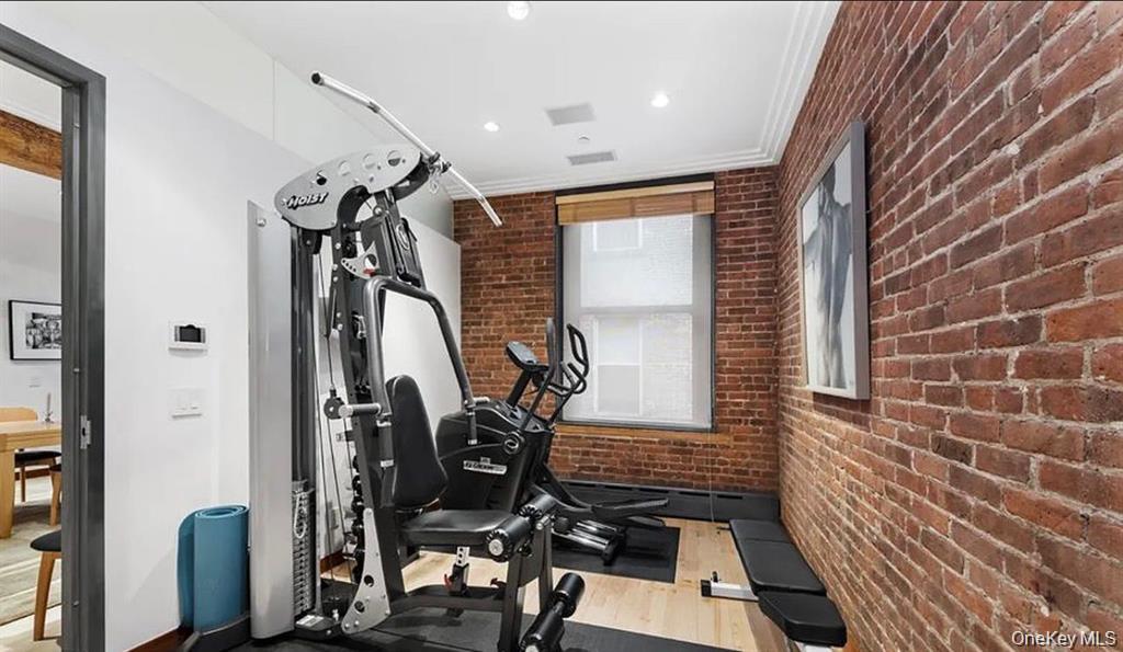 500 Greenwich Street, Unit 401 Manhattan, NY 10013 - Photo 18 of 22 a view of a room with gym equipment