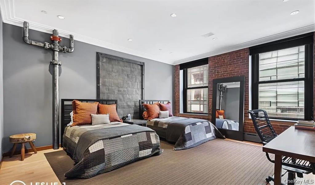 500 Greenwich Street, Unit 401 Manhattan, NY 10013 - Photo 19 of 22 a bedroom with two beds and a large window