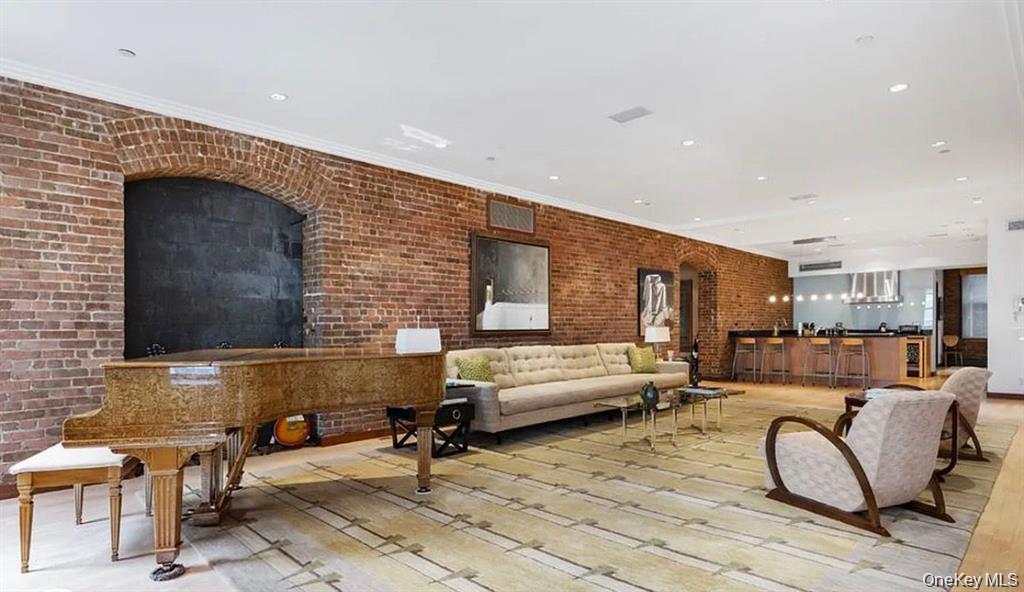 500 Greenwich Street, Unit 401 Manhattan, NY 10013 - Photo 4 of 22 a living room with patio furniture and a fireplace