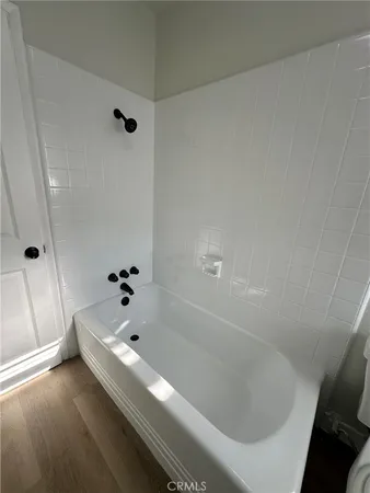 a bathroom with a bathtub and shower