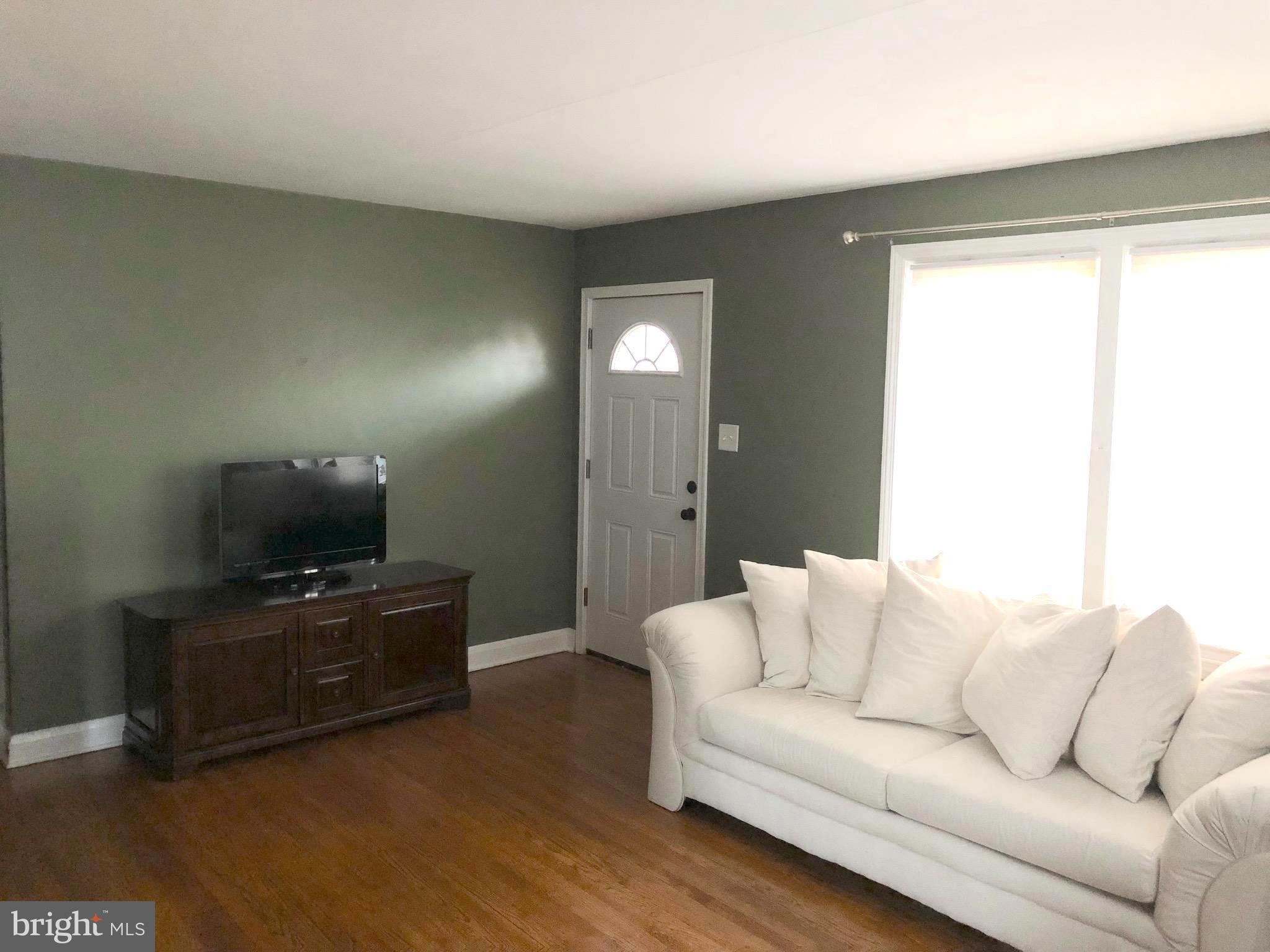 119 Montrose Road Pasadena, MD 21122 - Photo 4 of 10 Living Room is bright and airy!