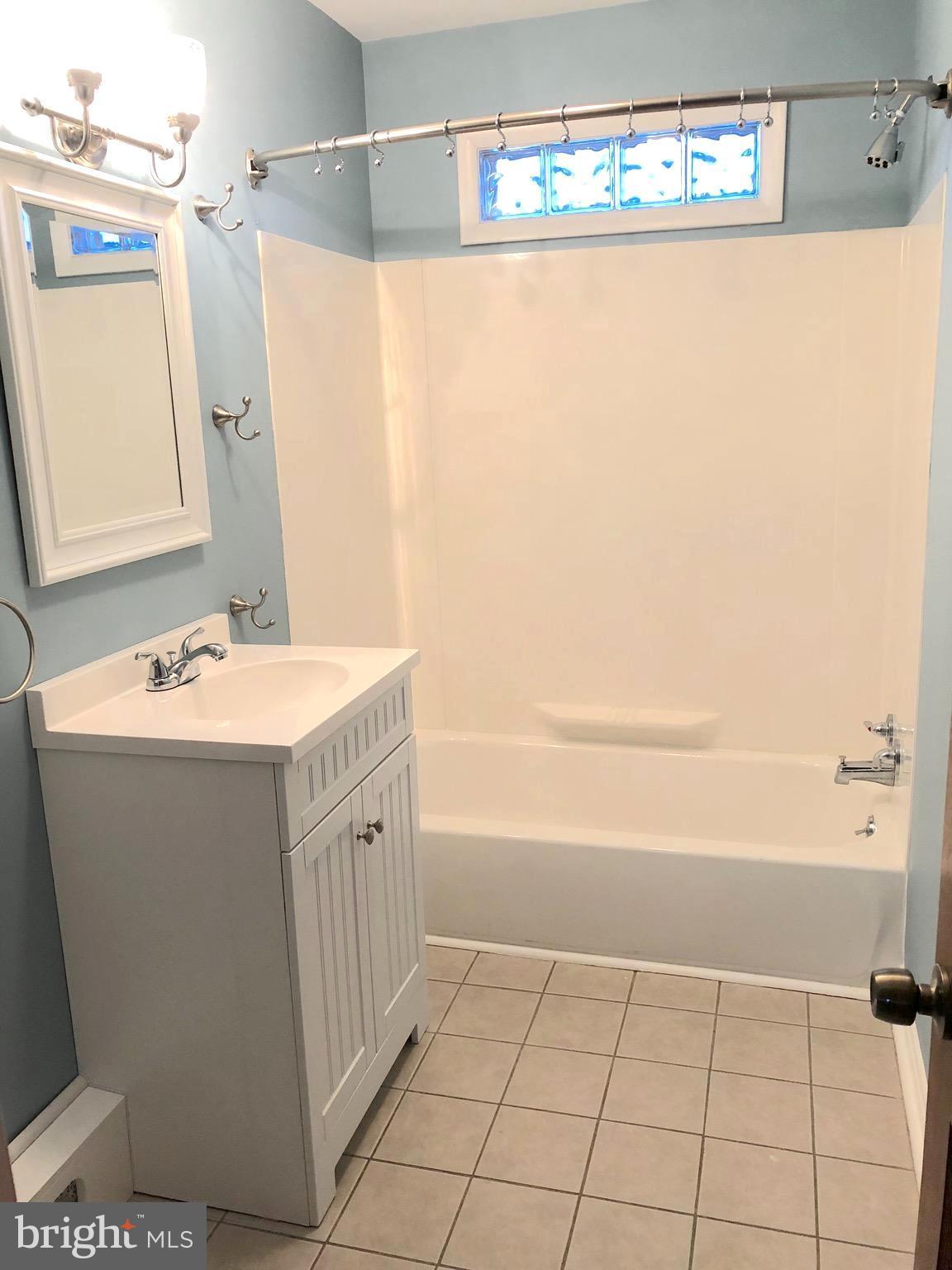 119 Montrose Road Pasadena, MD 21122 - Photo 6 of 10 Bath is bright and relaxing.