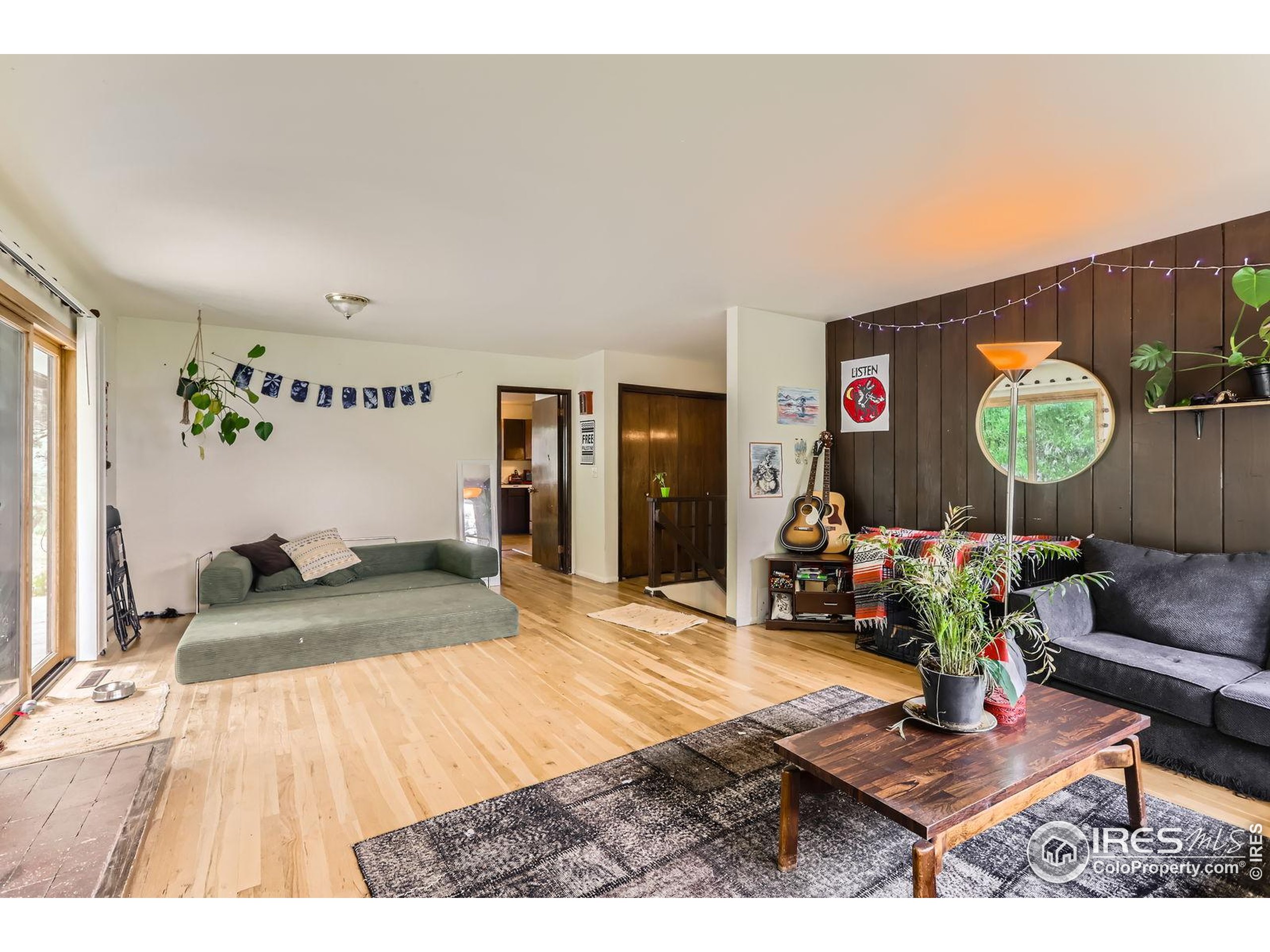 27 Arrowleaf Court Boulder, CO 80304 - Photo 12 of 29 a living room with furniture and a flat screen tv