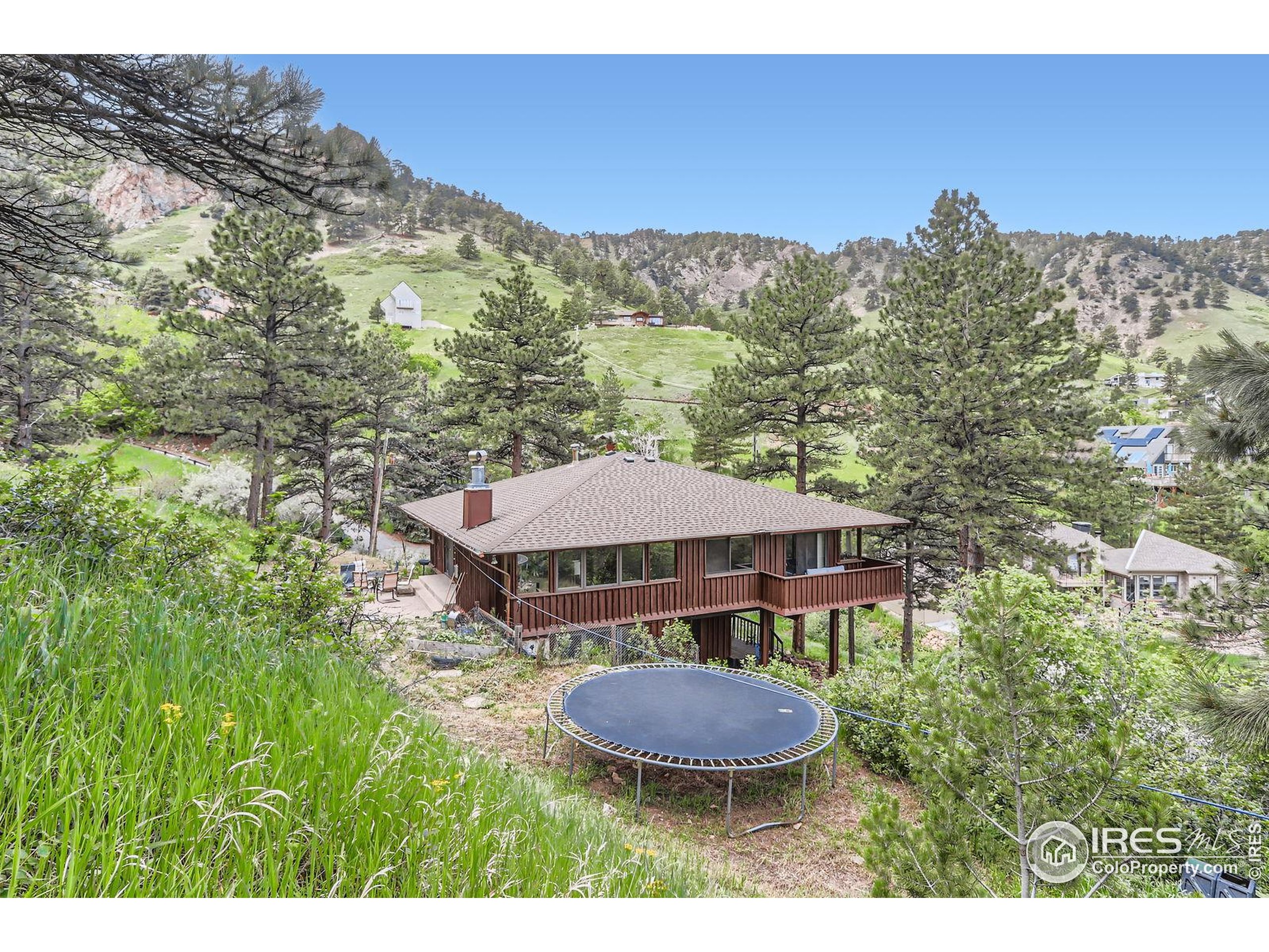 27 Arrowleaf Court Boulder, CO 80304 - Photo 23 of 29 a view of a house with a yard and mountain view