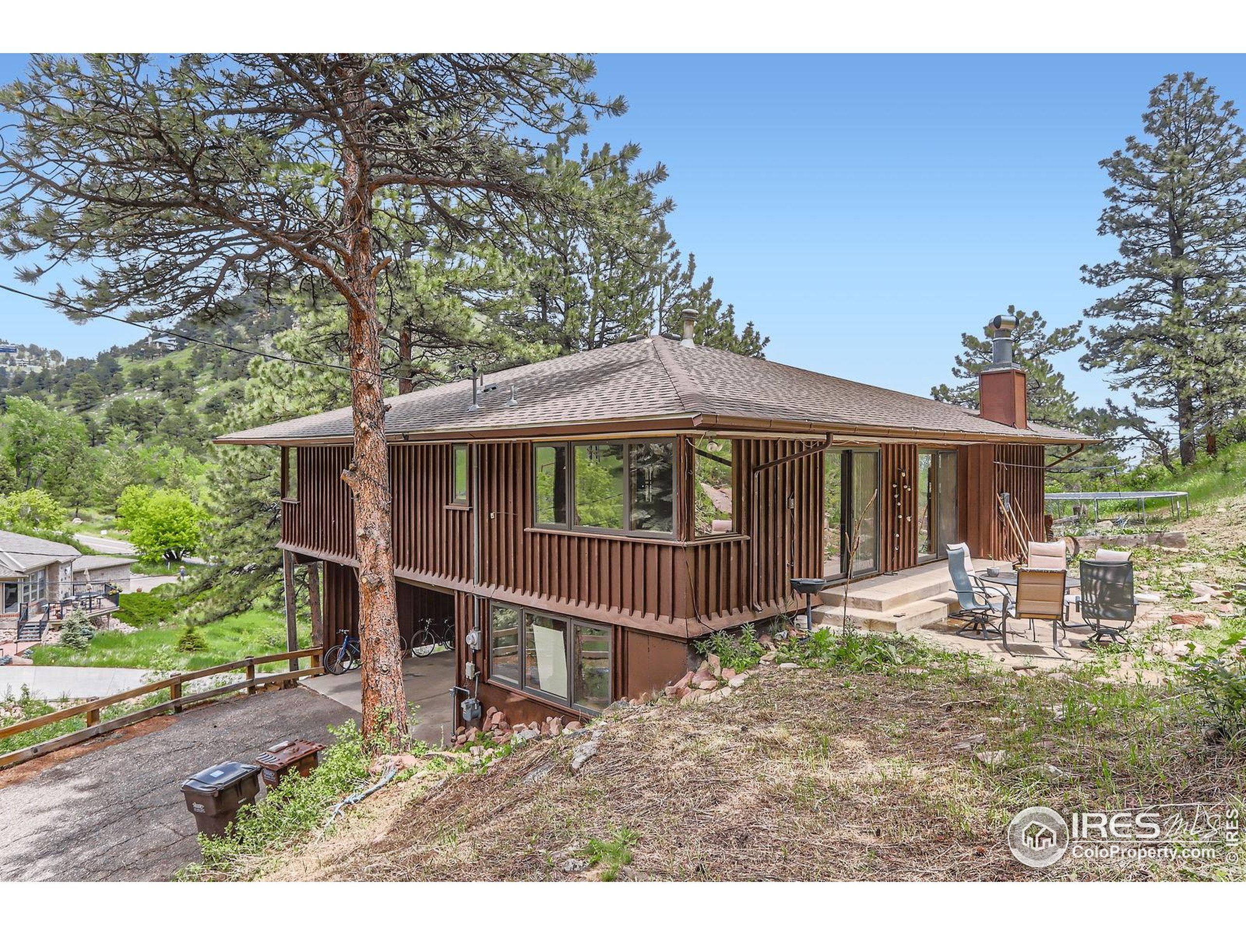 27 Arrowleaf Court Boulder, CO 80304 - Photo 3 of 29 a view of a house with a yard and wooden deck