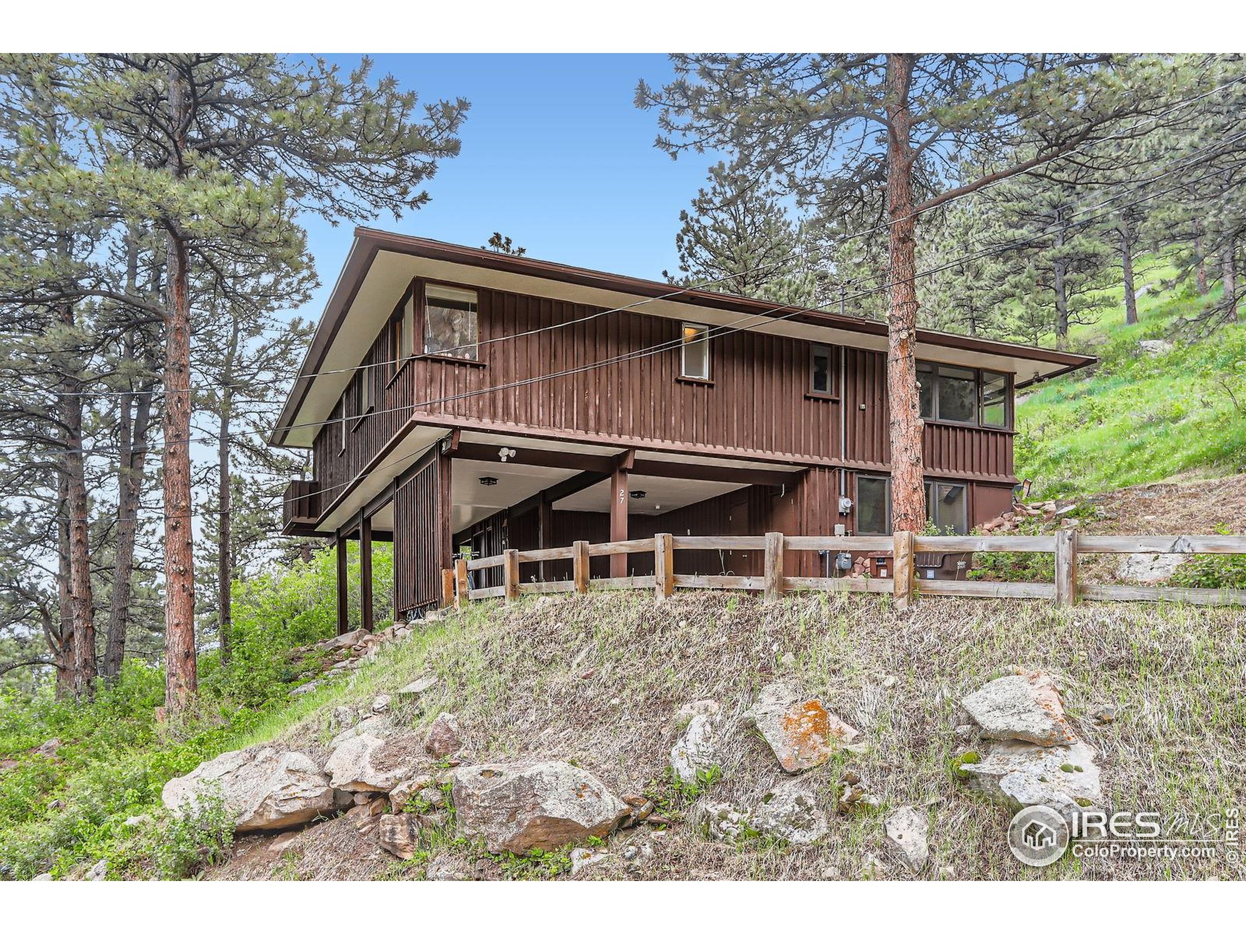 27 Arrowleaf Court Boulder, CO 80304 - Photo 4 of 29 a view of a house with a yard