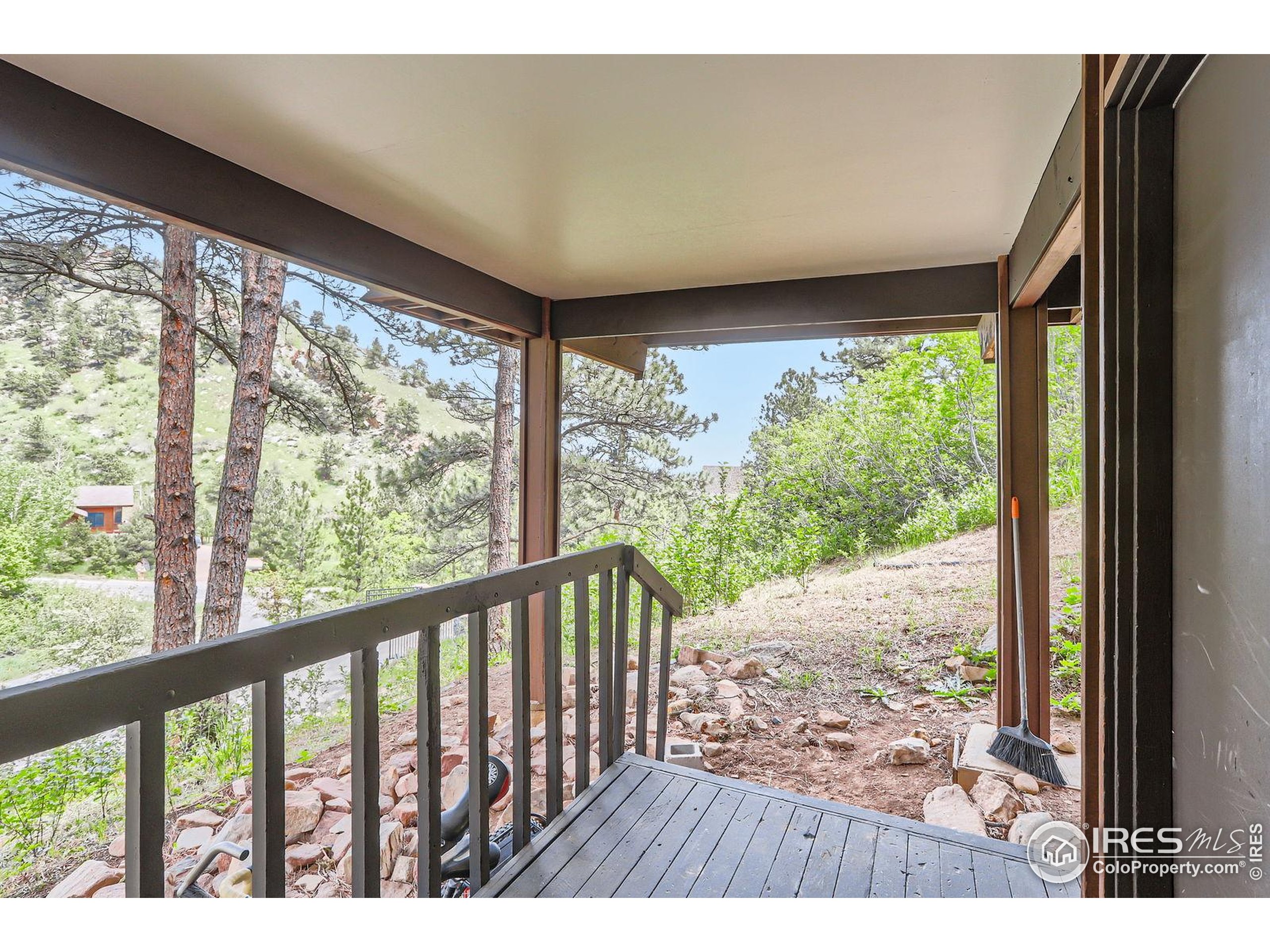 27 Arrowleaf Court Boulder, CO 80304 - Photo 6 of 29 a view of a porch and a yard
