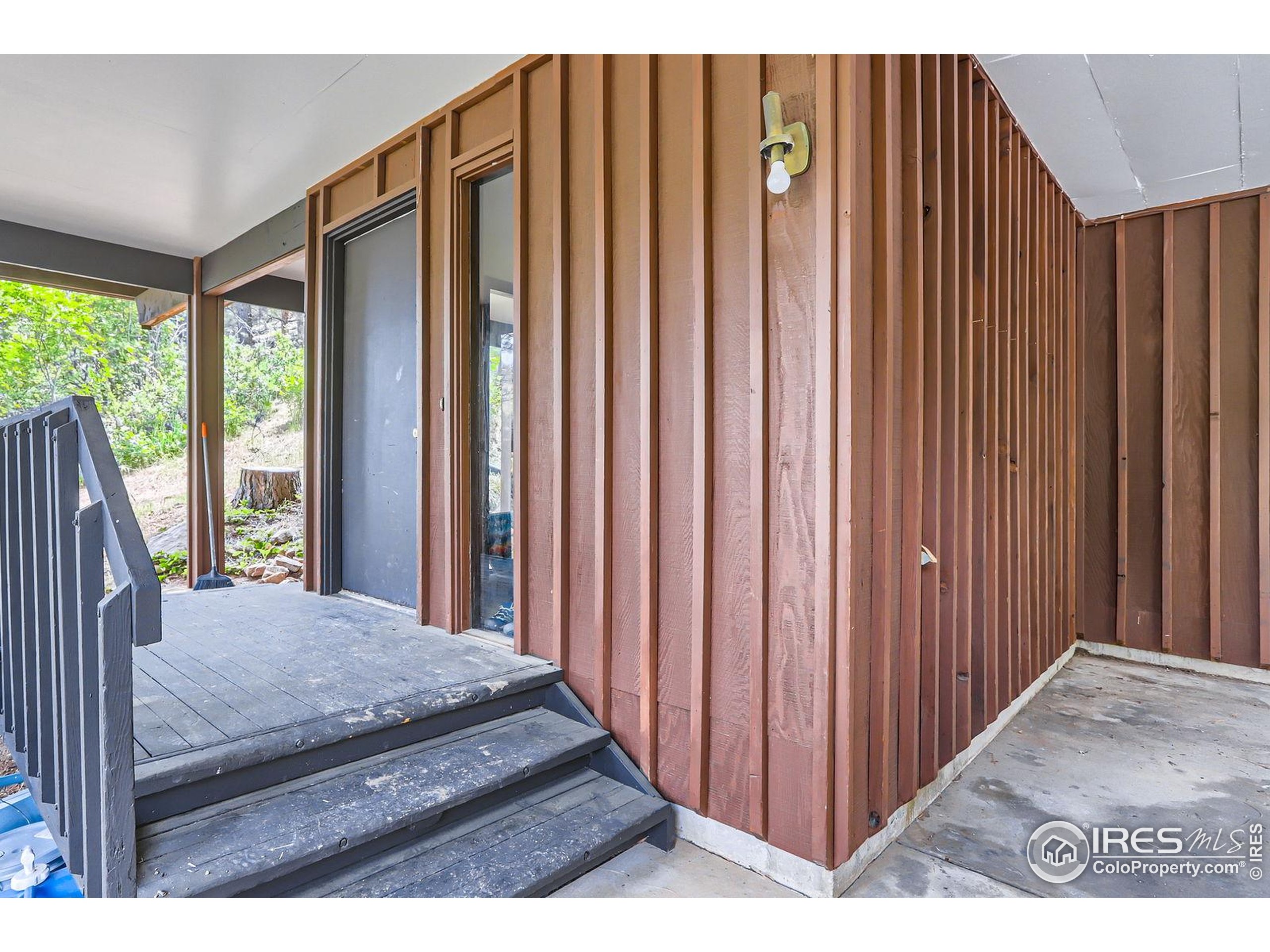 27 Arrowleaf Court Boulder, CO 80304 - Photo 8 of 29 a view of a bedroom with wooden floor and stairs