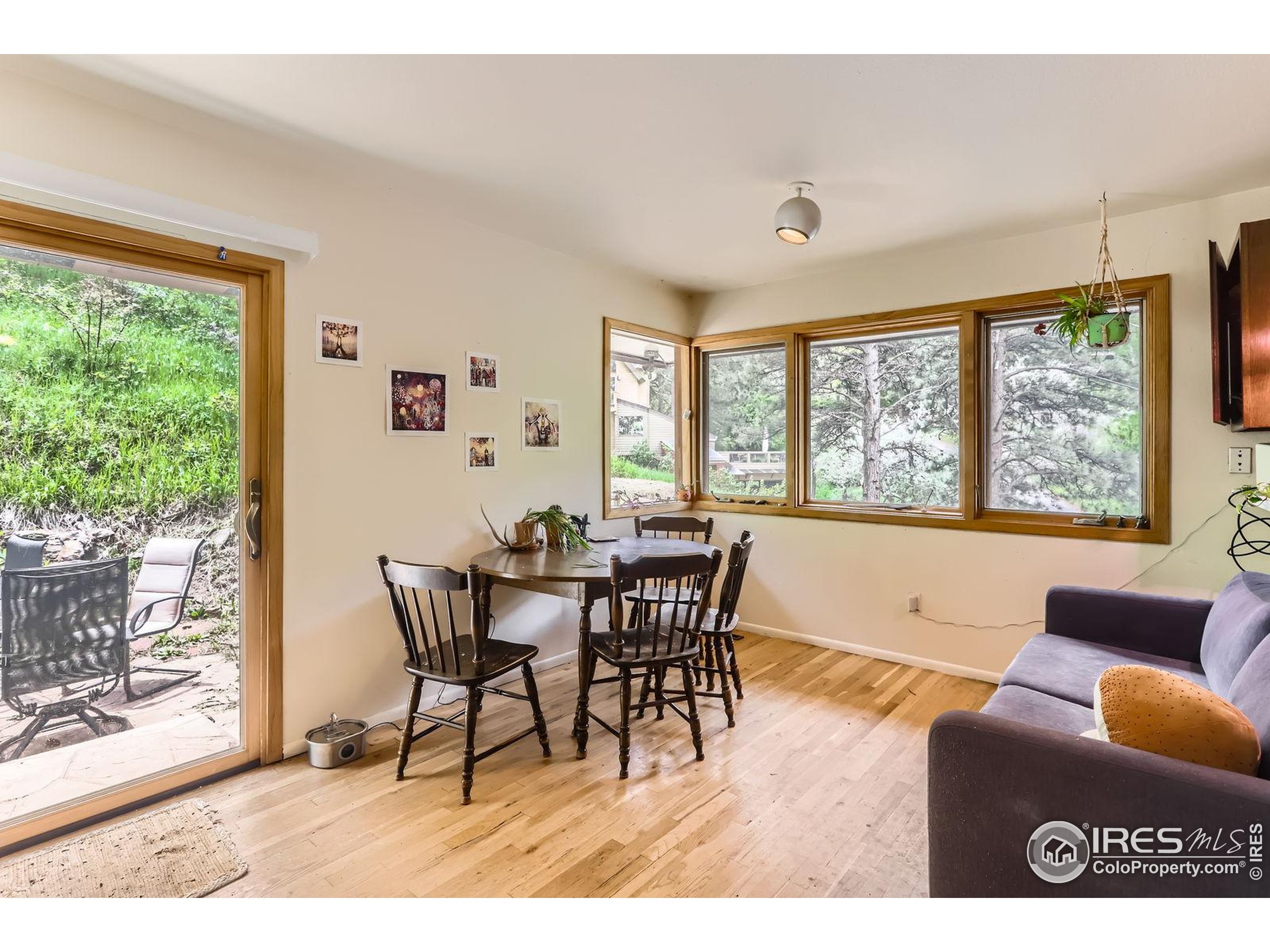 27 Arrowleaf Court Boulder, CO 80304 - Photo 9 of 29 a view of a dining room with furniture window and outside view