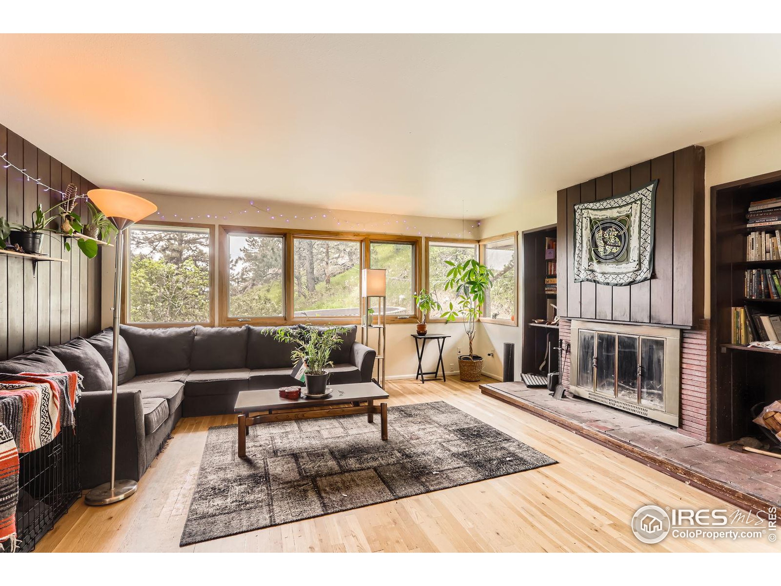27 Arrowleaf Court Boulder, CO 80304 - Photo 10 of 29 a living room with furniture and a large window