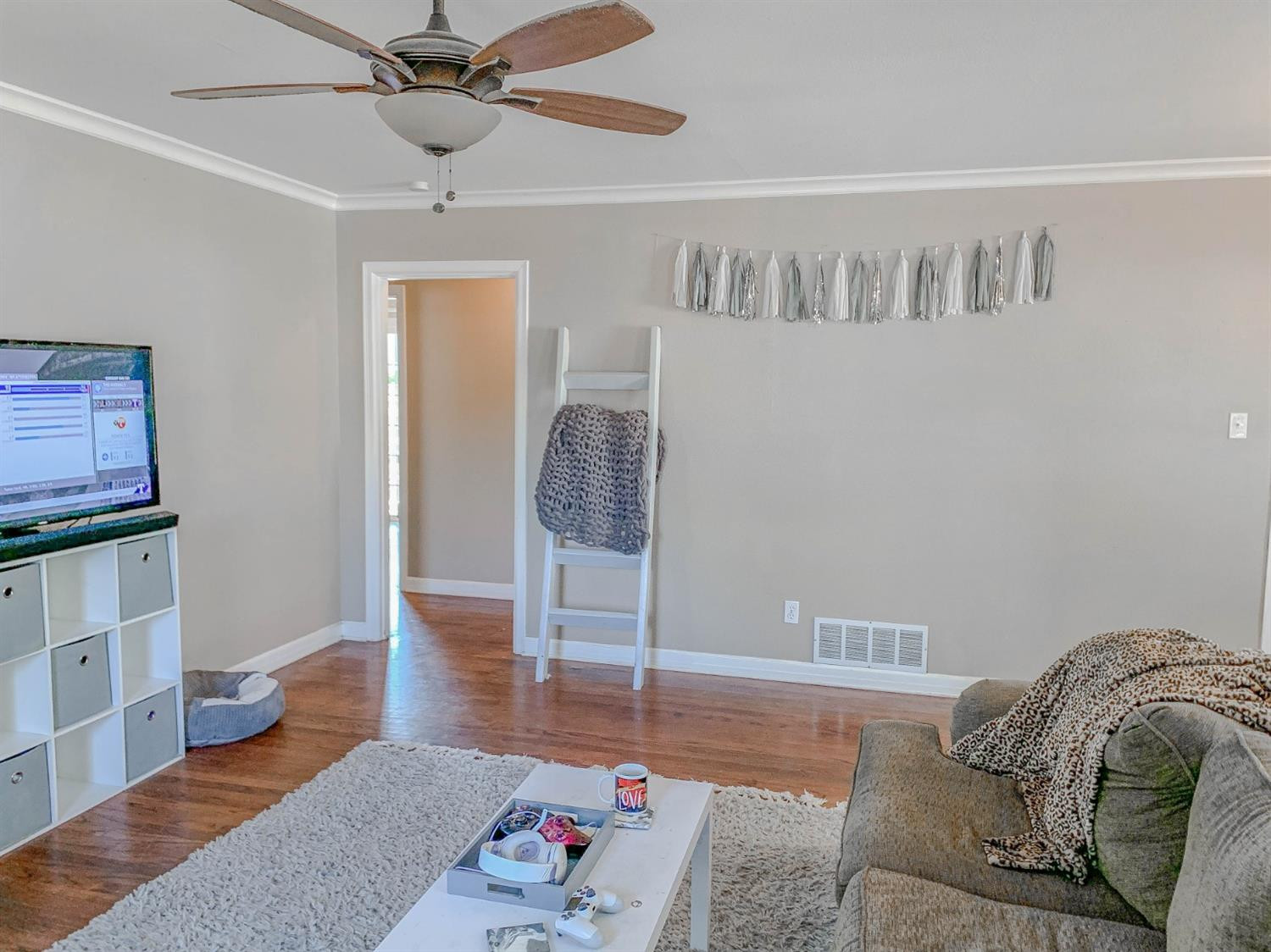 2401 26th Street Lubbock, TX 79411 - Photo 3 of 13 a living room with furniture and a wooden floor