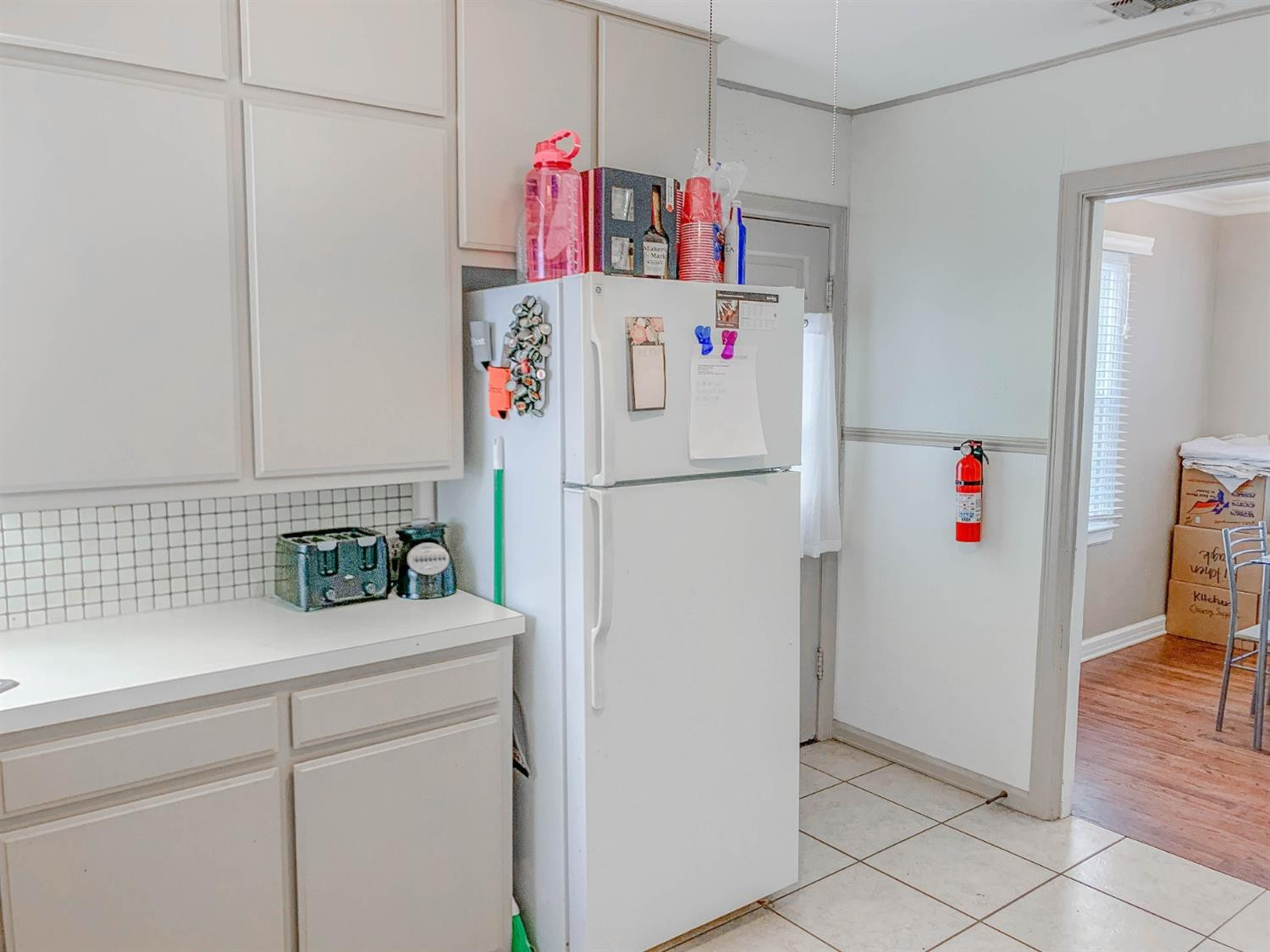 2401 26th Street Lubbock, TX 79411 - Photo 6 of 13 a white refrigerator freezer sitting inside of a kitchen