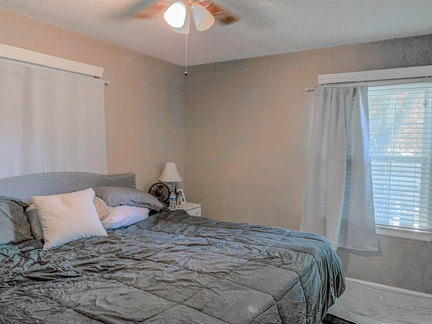 2401 26th Street Lubbock, TX 79411 - Photo 7 of 13 a bedroom with a bed and window