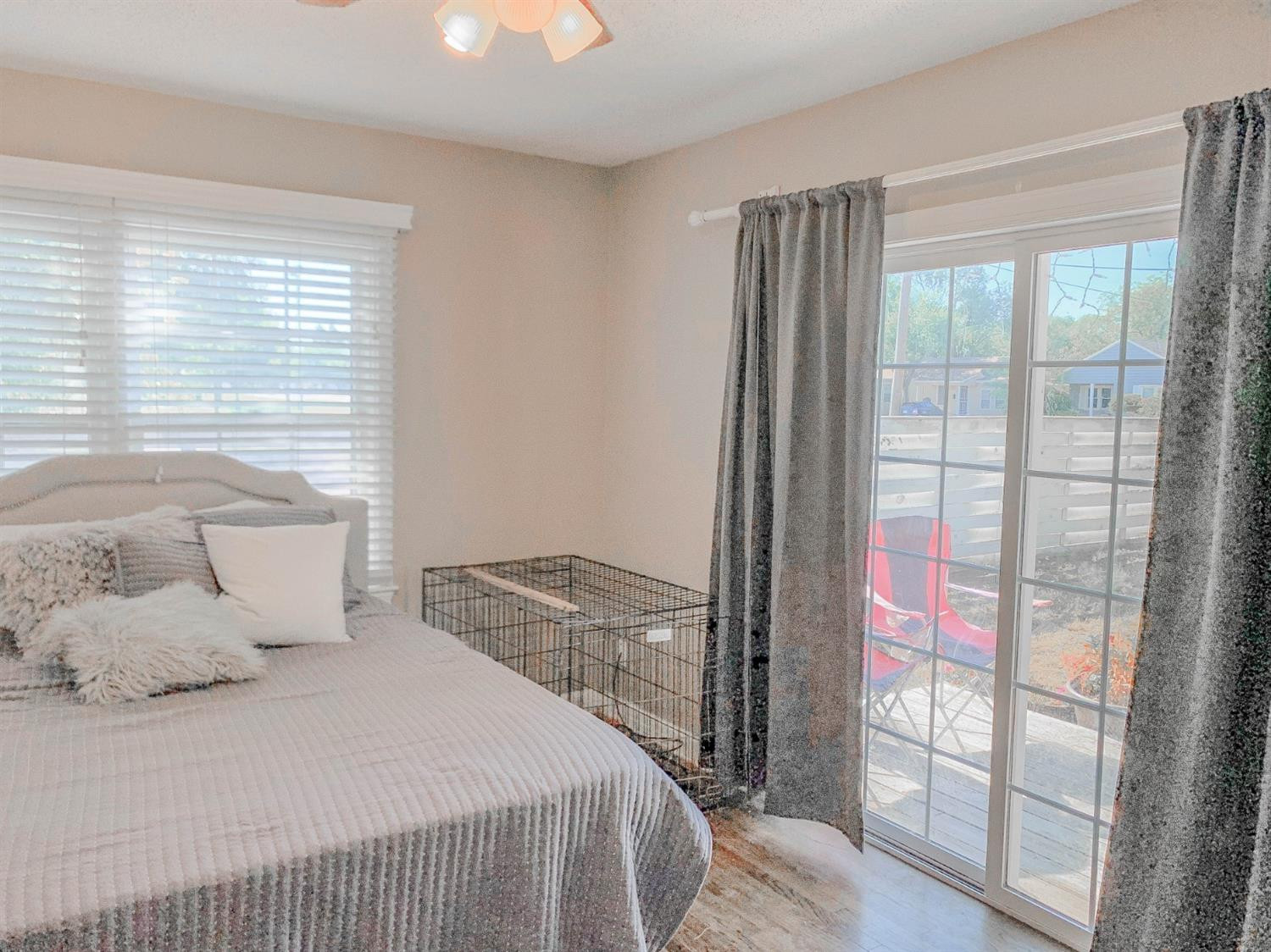 2401 26th Street Lubbock, TX 79411 - Photo 9 of 13 a bedroom with a bed and wooden floor