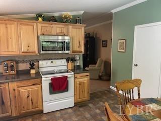 1065 Johnson Mountain Road Evington, VA 24550 - Photo 14 of 49 a kitchen with stainless steel appliances granite countertop a stove a sink and a refrigerator