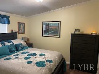 1065 Johnson Mountain Road Evington, VA 24550 - Photo 16 of 49 a bedroom with a bed and lamp