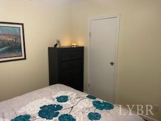 1065 Johnson Mountain Road Evington, VA 24550 - Photo 17 of 49 a bedroom with a bed and hallway