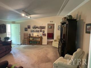 1065 Johnson Mountain Road Evington, VA 24550 - Photo 38 of 49 a living room with furniture and a refrigerator