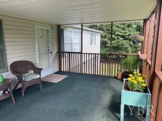 1065 Johnson Mountain Road Evington, VA 24550 - Photo 40 of 49 a balcony with chairs and a table