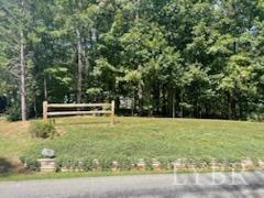 1065 Johnson Mountain Road Evington, VA 24550 - Photo 4 of 49 a view of yard with swimming pool and trees in the background