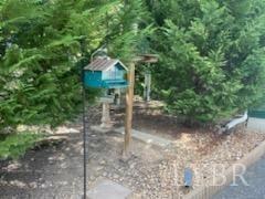 1065 Johnson Mountain Road Evington, VA 24550 - Photo 45 of 49 a view of a wooden house with a yard