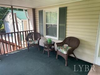 1065 Johnson Mountain Road Evington, VA 24550 - Photo 7 of 49 a living room with furniture and a window