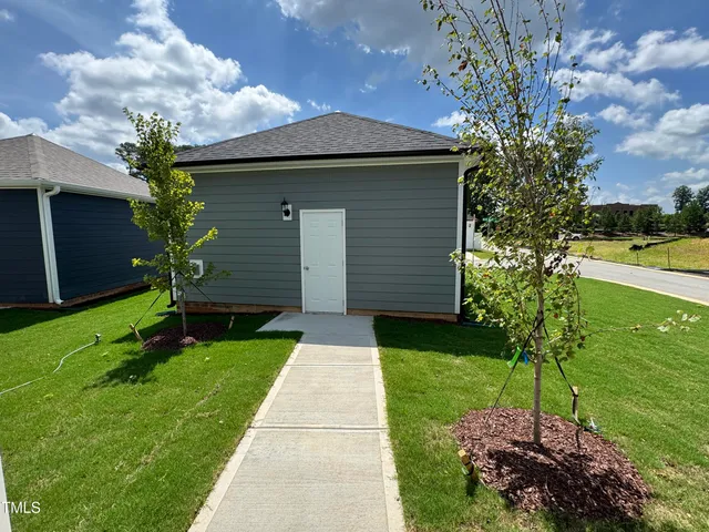 a house view with a garden space