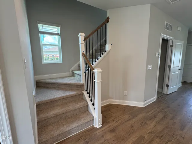 a view of entryway with wooden floor
