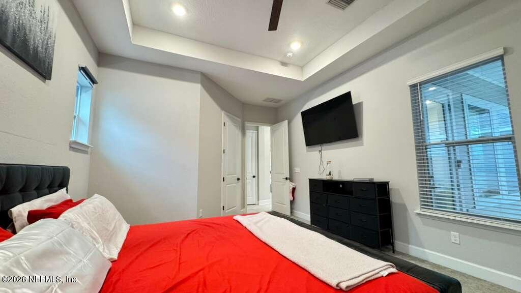 48 Bluebonnet Way St. Augustine, FL 32092 - Photo 14 of 46 a bedroom with a bed and a flat screen tv