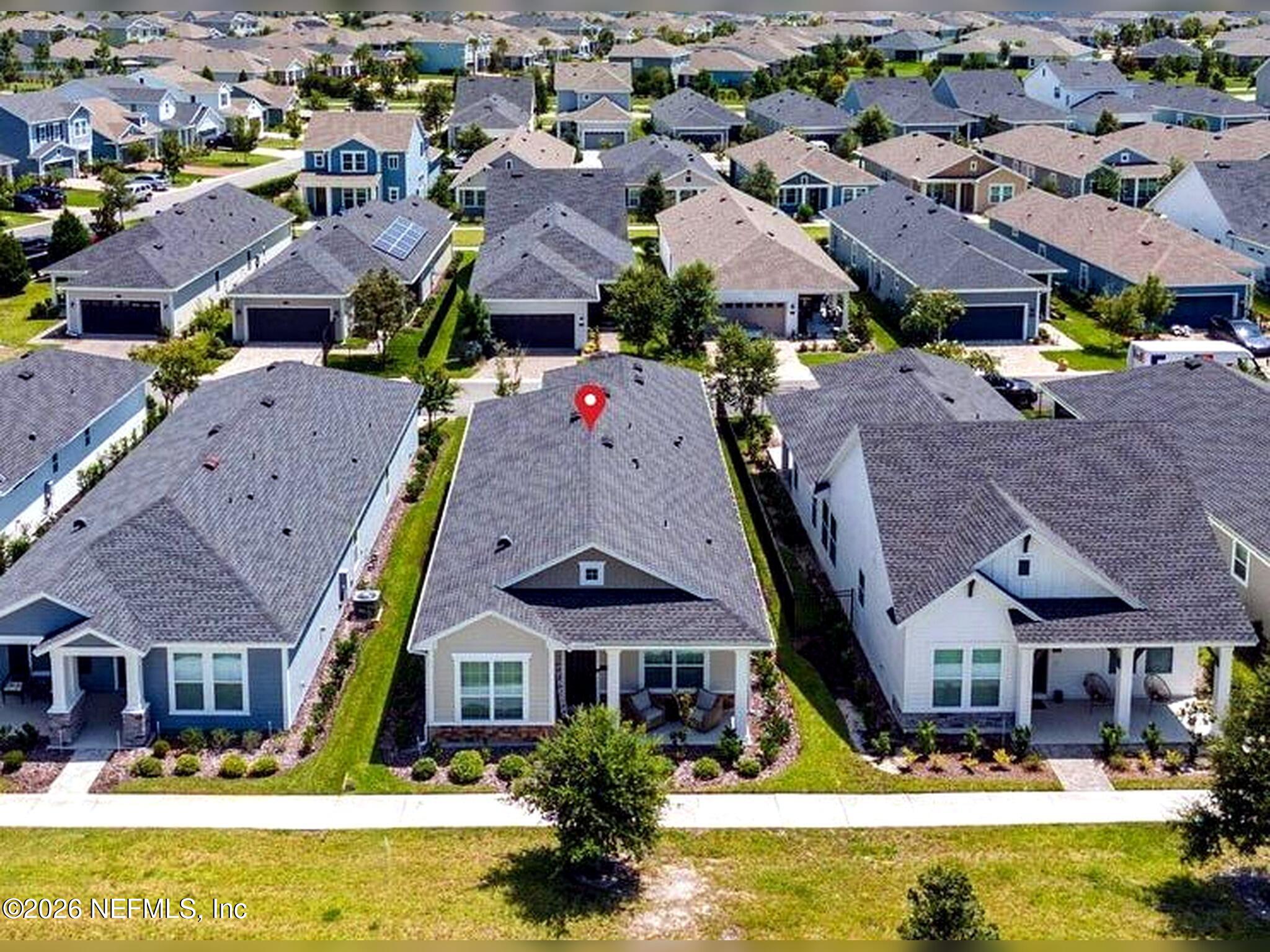 48 Bluebonnet Way St. Augustine, FL 32092 - Photo 24 of 46 an aerial view of multiple houses with swimming pool
