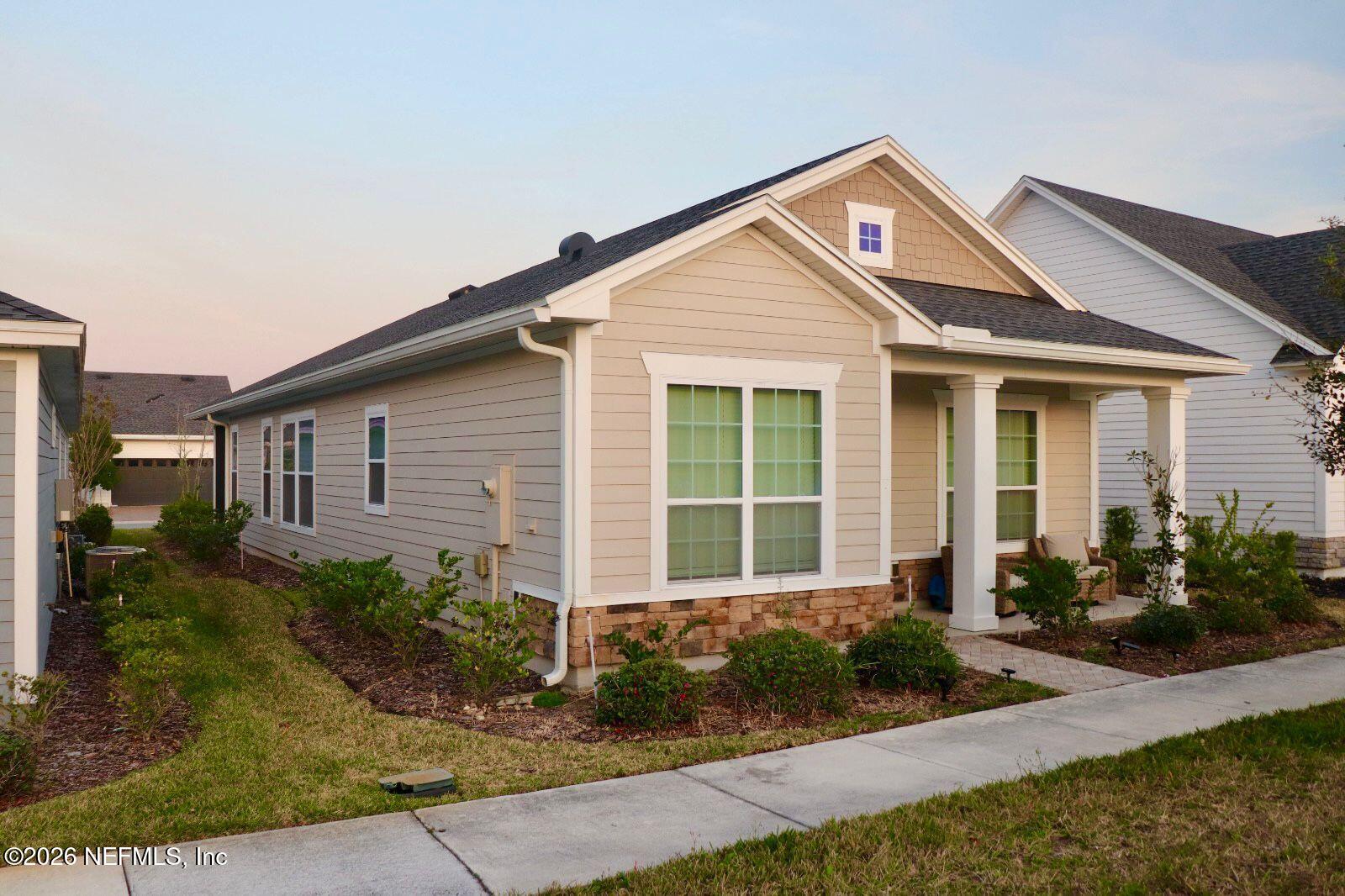 48 Bluebonnet Way St. Augustine, FL 32092 - Photo 3 of 46 a front view of a house with garden
