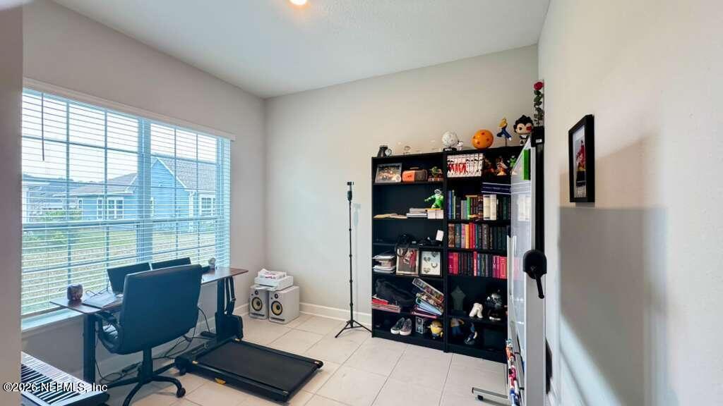 48 Bluebonnet Way St. Augustine, FL 32092 - Photo 5 of 46 a room with a book shelf and a window
