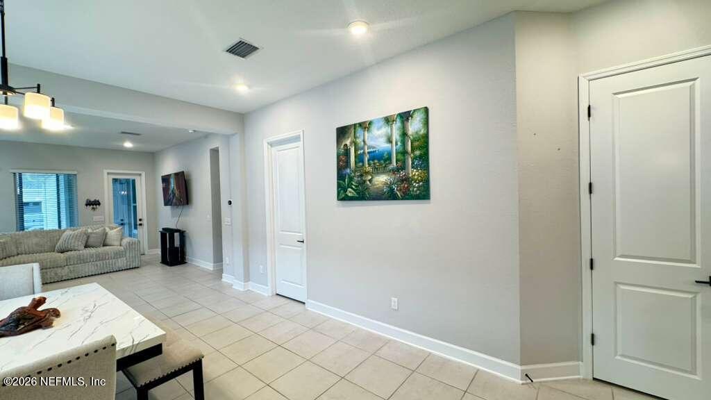 48 Bluebonnet Way St. Augustine, FL 32092 - Photo 9 of 46 a living room with furniture and a open to a window