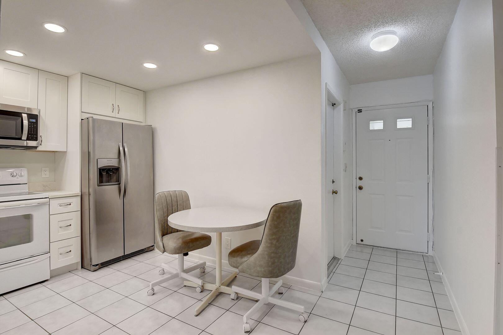 9111 Tracy Court, Unit 4 Boca Raton, FL 33496 - Photo 8 of 47 Kitchen / Front Entrance