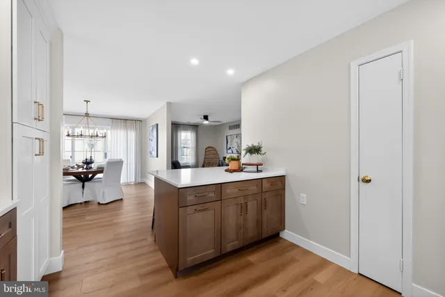 a kitchen with stainless steel appliances a sink and cabinets