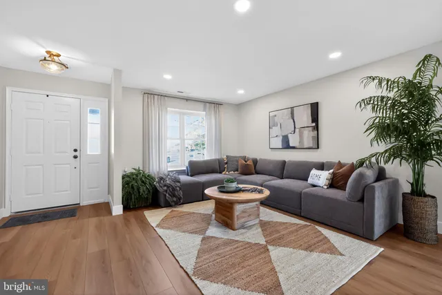 a living room with furniture and a rug