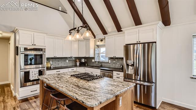 18155 Meridian Road Elbert, CO 80106 - Photo 6 of 41 Double stoves, gas range, leathered granite