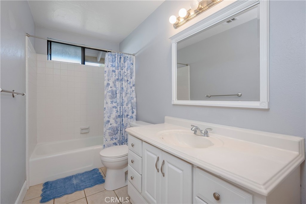 16810 Tava Lane Riverside, CA 92504 - Photo 12 of 33 a bathroom with a sink a toilet and shower