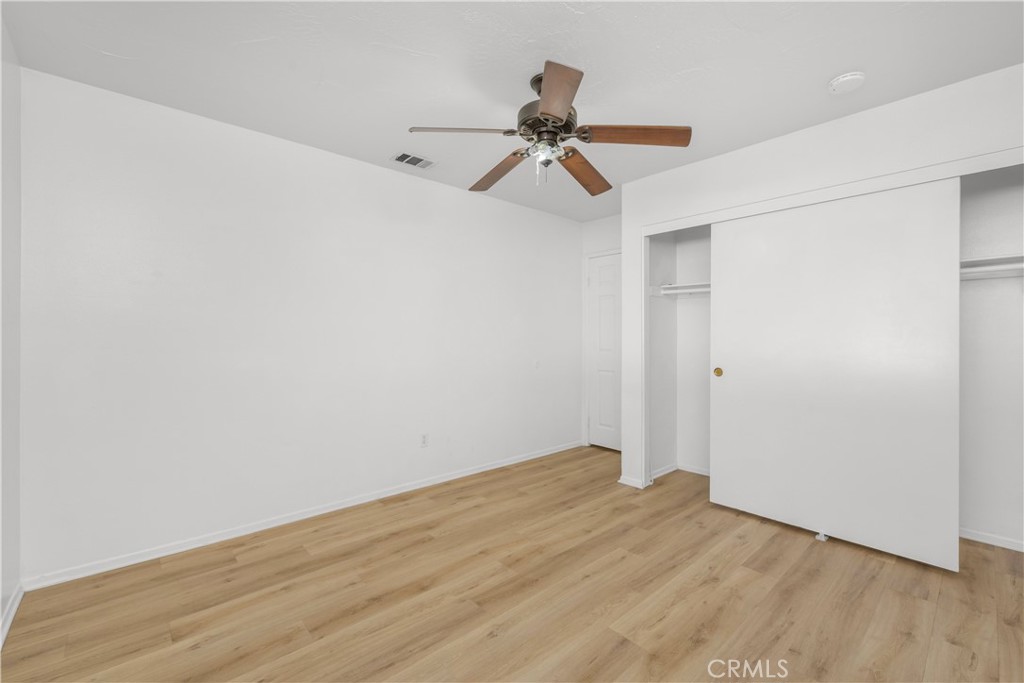 16810 Tava Lane Riverside, CA 92504 - Photo 16 of 33 a view of a room with wooden floor